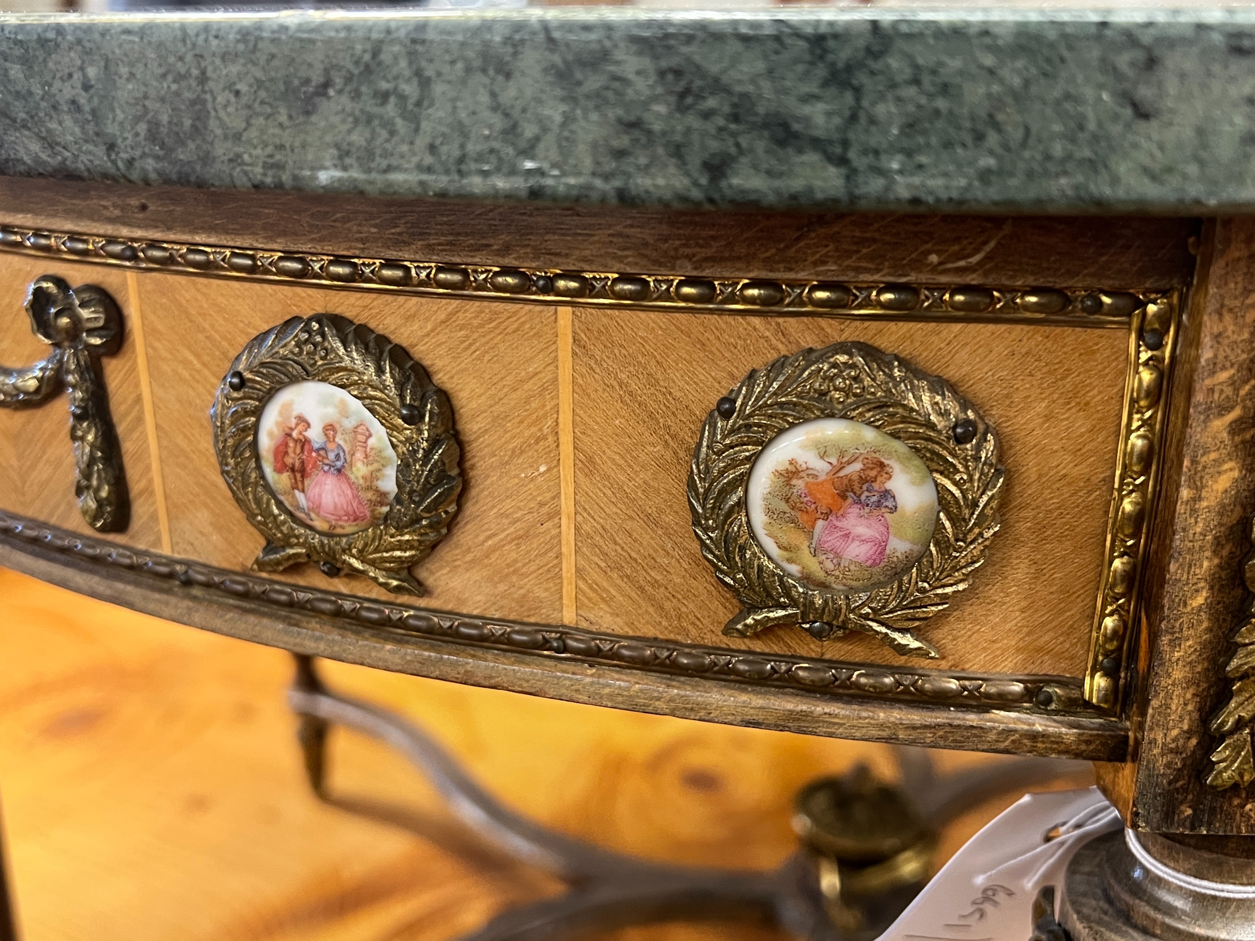 A Louis XVI design circular gilt metal and porcelain mounted marble top coffee table, diameter 84cm, height 48cm